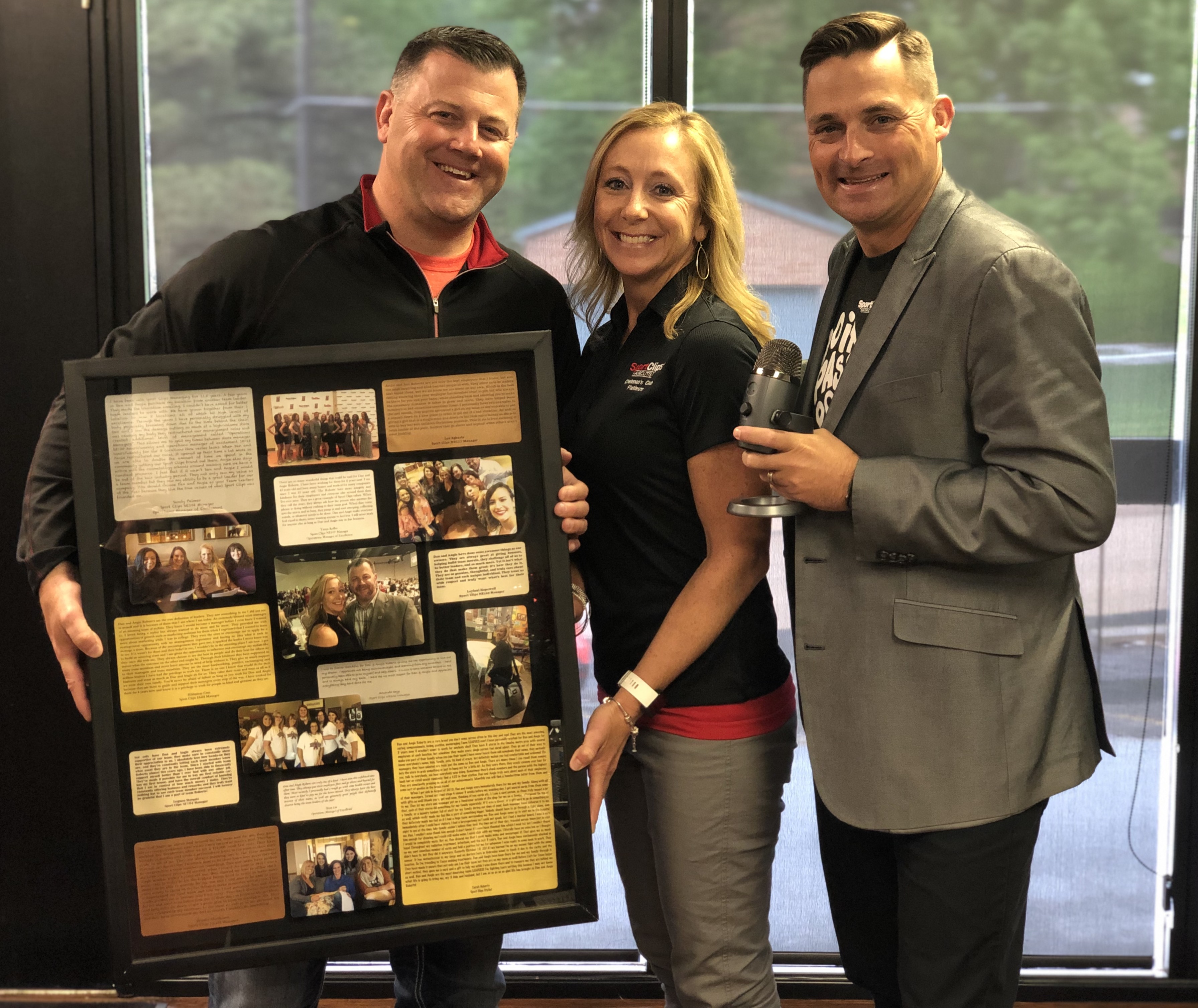 Chad Jordan with Dan and Angie Roberts holding a shadow box of photos